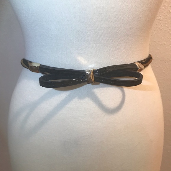 White House Black Market Accessories - WHBM skinny bow belt black animal print